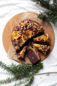 Chocolate and Rosemary Cake with Gin Soaked Prunes, Date Caramel, Roasted Oranges and Almonds