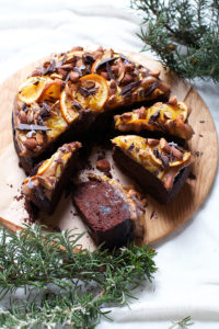 Rosemary scented Chocolate Cake with gin prunes, date caramel and oranges and almonds : recipe